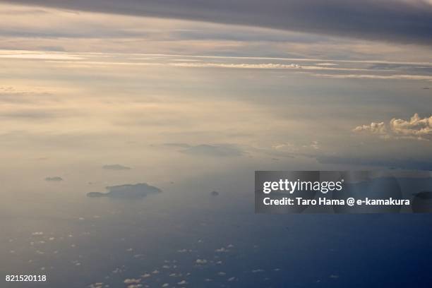 okinoshima island in sukumo city in kochi prefecture sunset time aerial view from airplane - okinoshima stock pictures, royalty-free photos & images