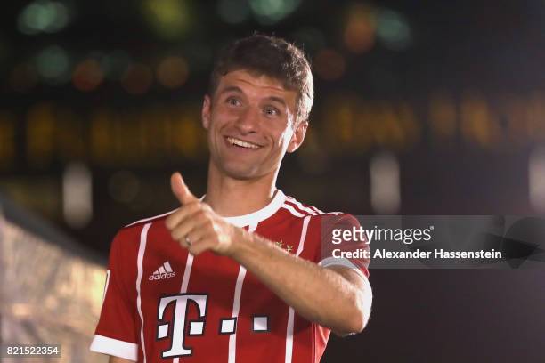 Thomas Mueller of FC Bayern Muenchen reacts during a adidas marketing event at Clifford square during the Audi Summer Tour 2017 on July 24, 2017 in...