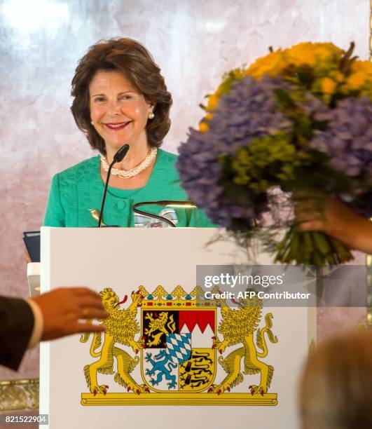 Queen Silvia of Sweden gives a speech after she was awarded the Bavarian Order of Merit at the Prinz-Carl-Palais in Munich, southern Germany, on July...