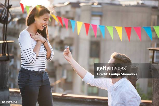 excited young woman getting engaged - man proposing indoor stock pictures, royalty-free photos & images