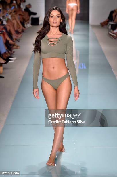 Model walks the runway at the Issa De'Mar Runway at FUNKSHION Swim Fashion Week at Funkshion Tent on July 23, 2017 in Miami Beach, Florida.