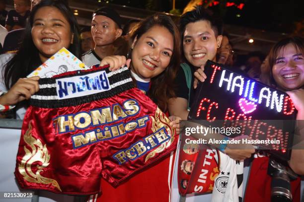 Supporter of FC Bayern Muenchen presenst a Thai-Boxing shorts for Thomas Meuller at a adidas marketing event at Clifford square during the Audi...