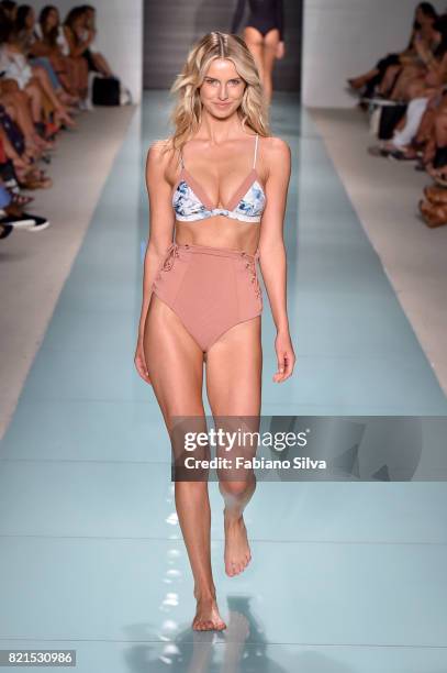 Model walks the runway at the Issa De'Mar Runway at FUNKSHION Swim Fashion Week at Funkshion Tent on July 23, 2017 in Miami Beach, Florida.