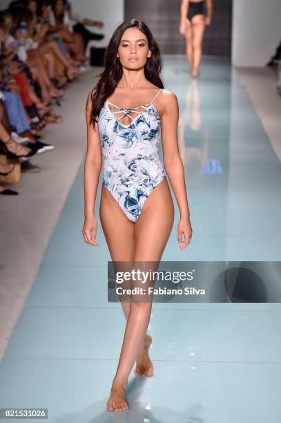 Model walks the runway at the Issa De'Mar Runway at FUNKSHION Swim Fashion Week at Funkshion Tent on July 23, 2017 in Miami Beach, Florida.