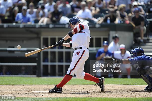 Joe Crede of the Chicago White Sox hits a three run home run during the game against the Kansas City Royals at U.S. Cellular Field in Chicago,...