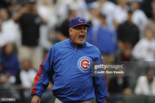 Manager Lou Piniella of the Chicago Cubs argues with umpires Rob Drake and Chad Fairfield after being ejected from the game for arguing an appealed...
