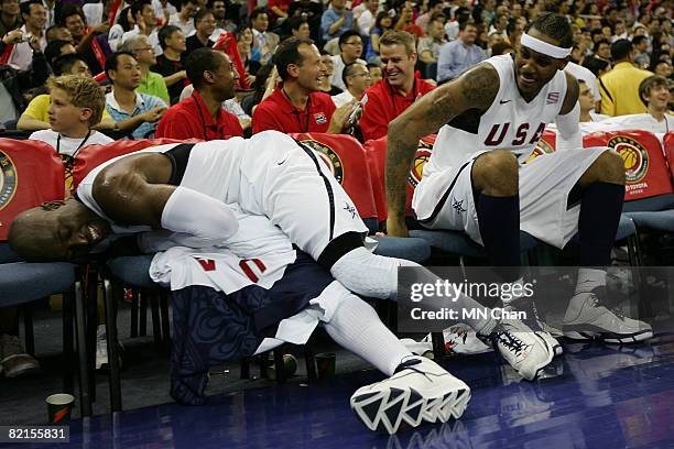 Dwyane Wade and Carmelo Anthony of the USA Basketball Men's Senior National Team sit on the bench during the USA Basketball International Challenge...