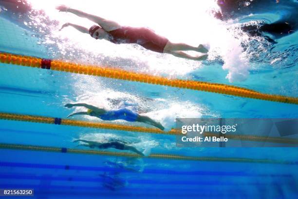 Kelsi Worrell of the United States, Sarah Sjostrom of Sweden and Emma Mckeon of Australia compete during the Women's 100m Butterfly Final on day...