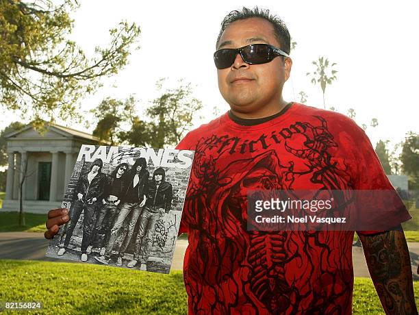 Fans show off their autographed memorabilia at the Tribute To Johnny Ramone at the Forever Hollywood Cemetery on August 1, 2008 in Los Angeles,...