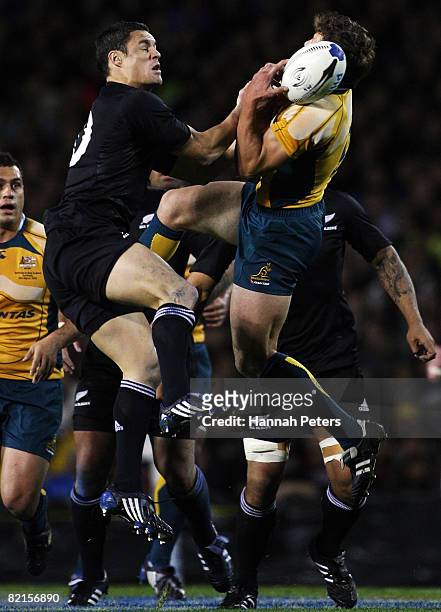 Daniel Carter of the All Blacks competes with Luke Burgess of the Wallabies during the 2008 Tri Nations series Bledisloe Cup match between the...