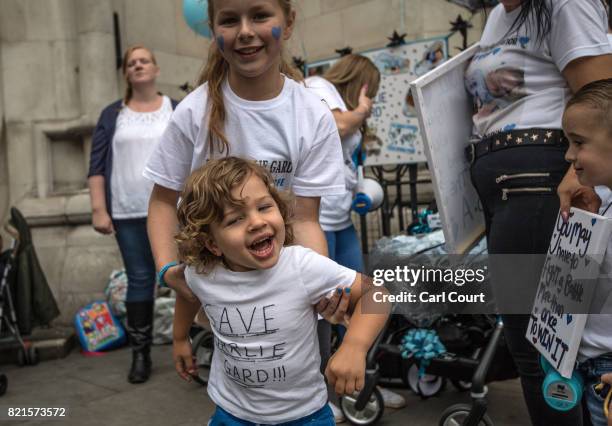 Supporters of of terminally ill baby Charlie Gard protest outside the High Court after the verdict was announced on July 24, 2017 in London, England....