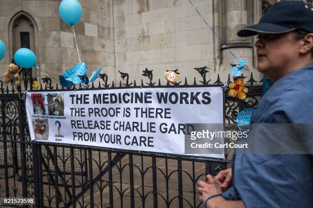 Supporters of of terminally ill baby Charlie Gard protest outside the High Court after the verdict was announced on July 24, 2017 in London, England....