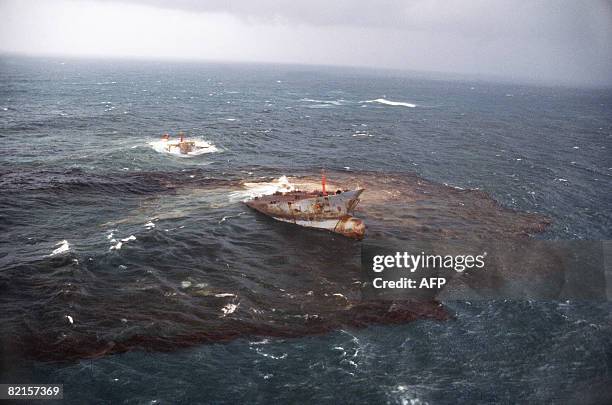 An Aerial view taken in March 1978 of the wreck of the Liberian oil tanker Amoco Cadiz, which ran aground near the small port of Portsall, on the...