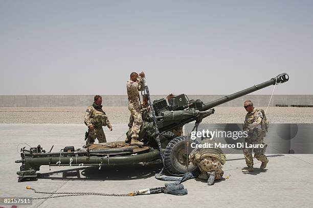 Australian Army soldiers from the 8th/12th Medium Regiment attached to the 7th Parachute Regiment Royal Horse Artillery are seen as they work on a...