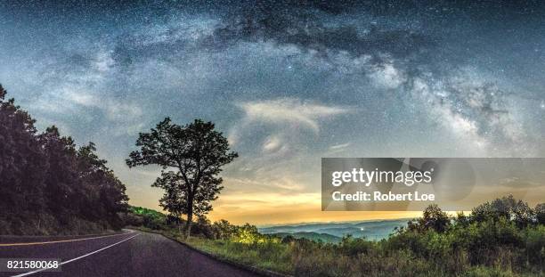 below the milky way at the blue ridge parkway - country road stock pictures, royalty-free photos & images