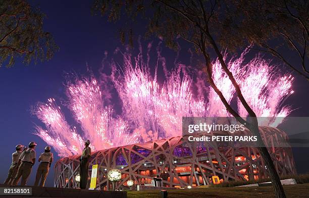 Fireworks light up the sky from the National Stadium also known as the "Bird's Nest" during rehearsals for the 2008 Olympic Games opening ceremony in...
