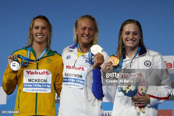 Silver medalist Emma Mckeon of Australia, gold medalist Sarah Sjostrom of Sweden and bronze medalist Kelsi Worrell of the United States pose with the...