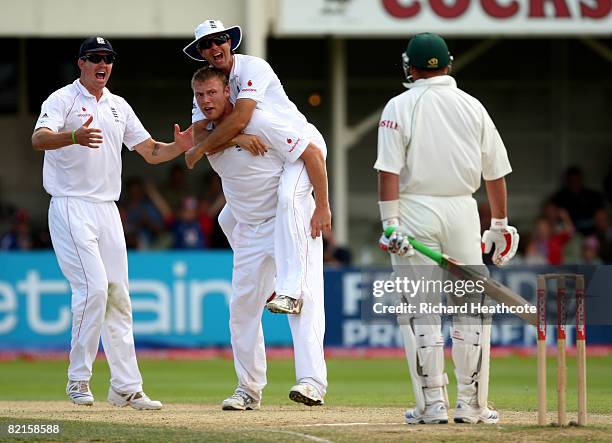 Andrew Flintoff of England celebrates taking the wicket of Jacques Kallis with Michael Vaughan during the 3rd npower Test Match between England and...