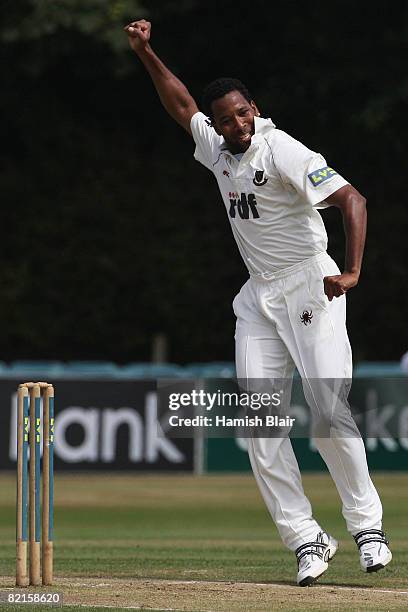 Corey Collymore of Sussex celebrates the wicket of Marcus Trescothick of Somerset during day four of the LV County Championship match between Sussex...