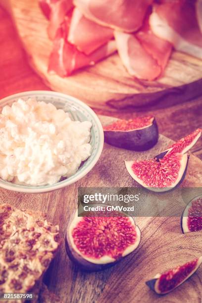 crispbread with serrano ham, cottage cheese, and figs - knäckebrot stock pictures, royalty-free photos & images