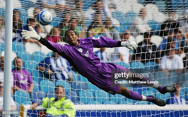 Goalkeeper Lee Grant of Sheffield Wednesday saves the free kick from Daniel De Ridder of Wigan during the pre-season friendly match between Sheffield...