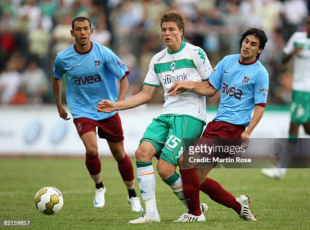 Sebastian Proedl of Bremen and Hrvoif Cale of Trabzonspor compete for the ball during the friendly match between Werder Bremen and Trabzonspor at the...