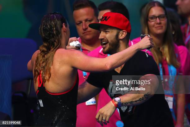 Katinka Hosszu of Hungary celebrates winning gold in the Women's 200m Individual Medley Final with her husband Shane Tusup on day eleven of the...