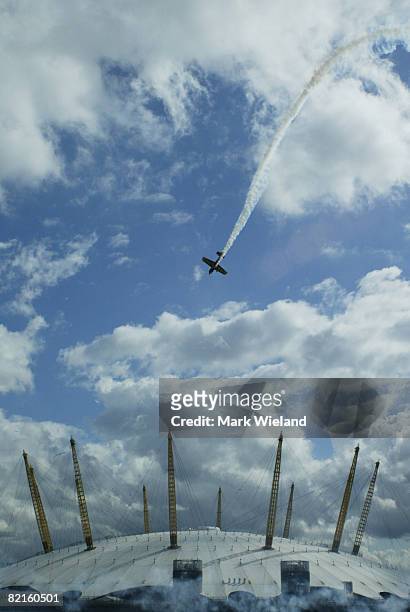 General view of a plane flying above the O2 Arena in Greenwich during the Red Bull Air Race on August 2, 2008 in London. The race takes place in 9...