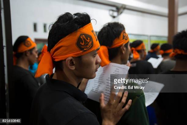 Indonesian Banser recruits listen during a class lecture about Indonesia's pluralistic philosophy called "Pancasila" during a rigorous three day...
