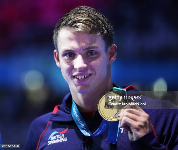 Benjamin Proud of Great Britain poses with his gold medal from the final of Men's 50m Butterfly on day eleven of the FINA World Championships at the...