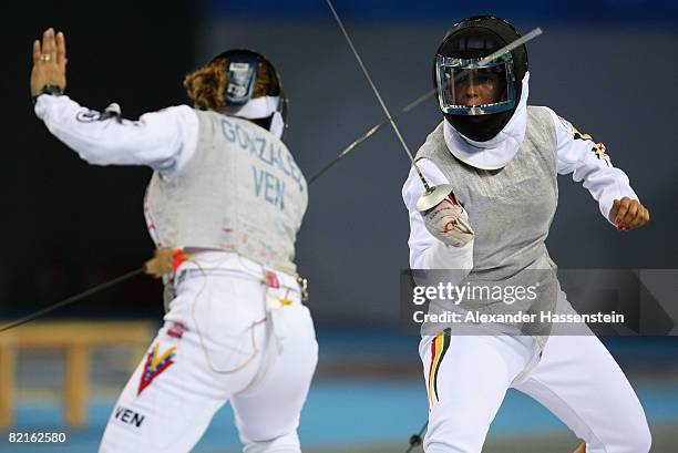 Mariana Isabel Gonzalez Parra of Venezuela fences against Debora Nogueira of Portugal in the women's foil practice at the Fencing Hall ahead of the...