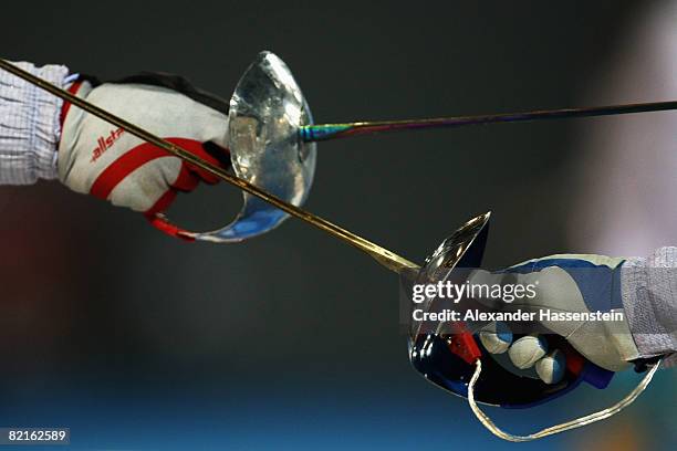 Detail view while Mariana Isabel Gonzalez Parra of Venezuela fences against Debora Nogueira of Portugal in the women's foil practice at the Fencing...