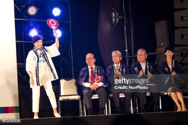 Tokyo Gov. Yuriko Koike waves to public before her speech with the hosts and guests Toshiro Muto, Tsunekazu Takeda, Mitsunori Torihara, Tamayo...