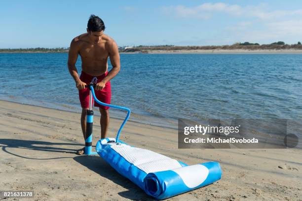 Pumping Up 228 Pumping Up Inflatable Stock Photos, High-Res Pictures, and Images ...