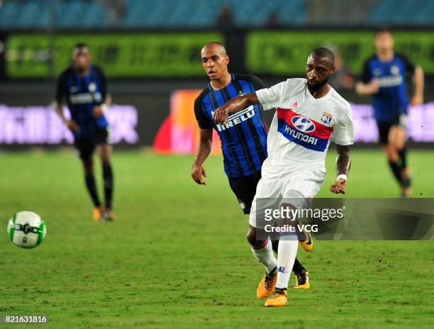 Joao Mario of FC Internazionale and Nicolas Nkoulou of Lyon compete for the ball during the 2017 International Champions Cup match between FC...