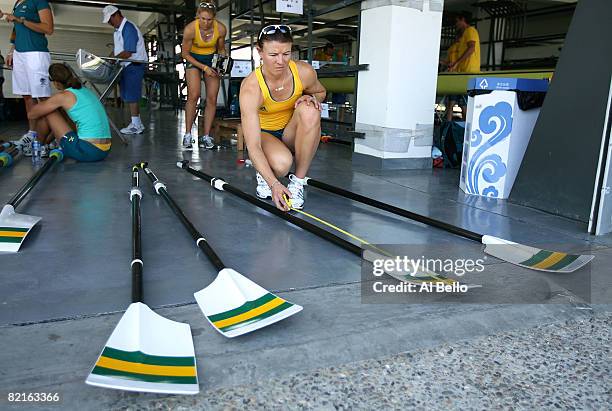 Sonia Mills of Australia measures an oar before practice for the Women's Double Sculls at the Shunyi Olympic Rowing-Canoeing Park ahead of the...