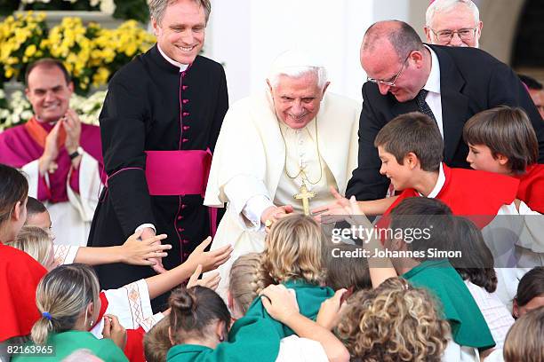 Pope Benedict XVI is welcomed by children in front of Brixen Cathedral after a sunday Angelus prayer on August 3, 2008 in Brixen, Italy. Pope...