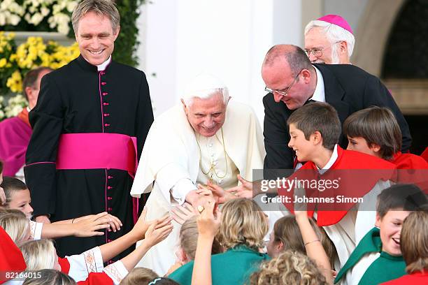 Pope Benedict XVI is welcomed by children in front of Brixen Cathedral after a sunday Angelus prayer on August 3, 2008 in Brixen, Italy . Pope...