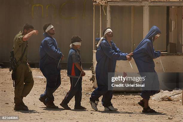 Fatah fighters, who fled from Hamas gunmen in the Gaza Strip during the night, are detained at an Israeli army base on August 3, 2008 at the Nahal Oz...