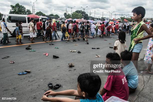 An installation art is displayed on the side of the road as protesters urge the president to stop the war on drugs and extra-judicial killings. The...