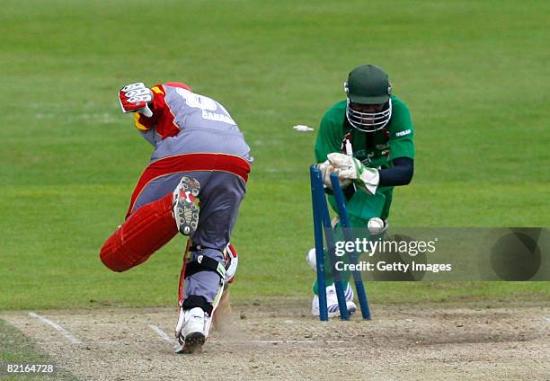 Karun Jethi of Canada is run out by Morris Ouma Amollo of Kenya during the Kenya v Canada ICC World Twenty20 Cup Qualifier on August 3, 2008 in...
