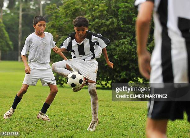 Josue Justiniani vies for the ball with Aldair Gonzalez during a training session at a sports school in the ex military base Clayton in Panama City...