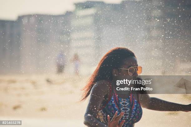 beautiful young black woman at the beach. - long beach new york imagens e fotografias de stock