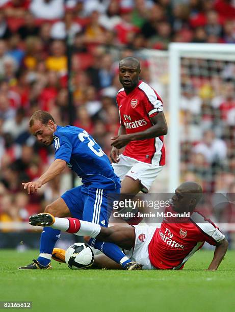 Wesley Sneijder of Real Madrid battles for the ball with Abou Diaby of Arsenal during the pre-season friendly match between Arsenal and Real Madrid...