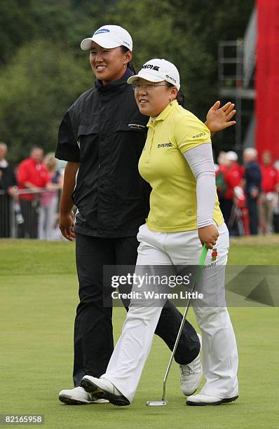 Ji-Yai Shin of South Korea is congratulated by fellow Korean golfer Amy Yang after winning the 2008 Ricoh Women's British Open held on the Old Course...