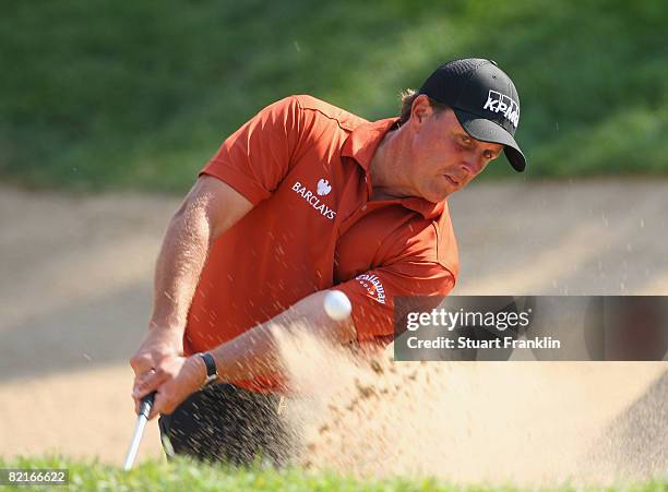 Phil Mickelson of USA plays his bunker shot on the 15th hole during final round of the World Golf Championship Bridgestone Invitational on August 3,...