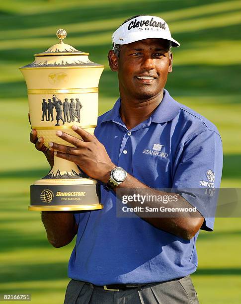 Vijay Singh of Fiji holds the Gary Player trophy after winning the WGC-Bridgestone Invitational at Firestone Country Club South Course on August 3,...
