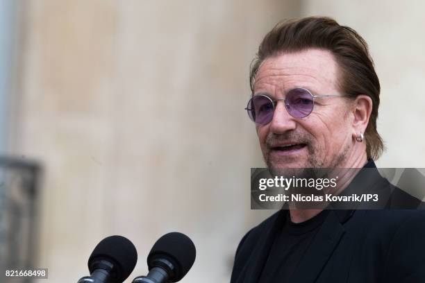 Bono, singer of U2 and cofounder of the NGO One, delivers a speech after his meeting with French President Emmanuel Macron during a press conference...