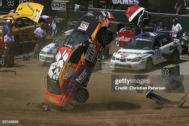 Drivers Andrew Comrie-Picard and Jen Horsey flip their car in a crash during the Rally Car race at summer X Games 14 at Home Depot Center on August...