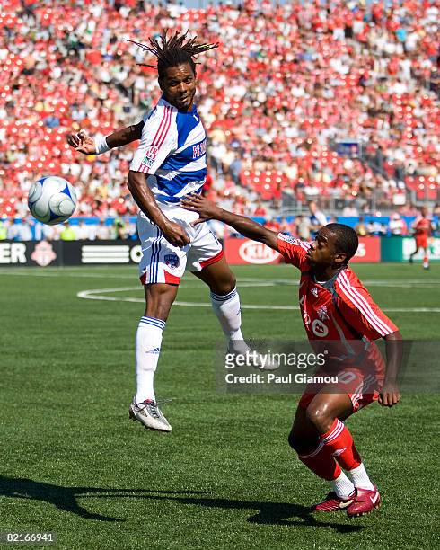 Rohan Ricketts of Toronto FC watches the ball sail past Adrian Serioux of FC Dallas during the match on August 3, 2008 at BMO Field in Toronto,...